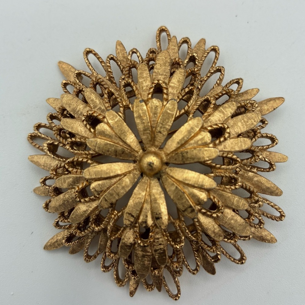 Large Vintage Monet gold-tone modernist starburst brooch